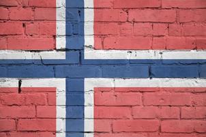 Norge flagga är målad till ett gammal tegel vägg foto