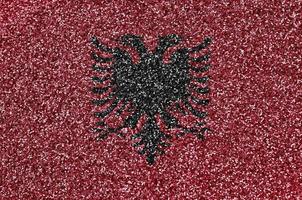 albania flagga avbildad på många små skinande paljetter. färgrik festival bakgrund för fest foto