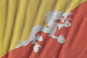 bhutan flagga tryckt på en polyester nylon- sportkläder maska tyg foto