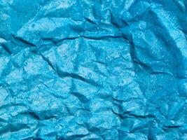 textur av blå skrynkliga papper bakgrund för design foto