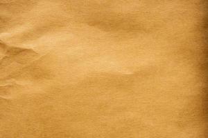 brun skrynkliga papper återvunnet kraft ark textur bakgrund foto