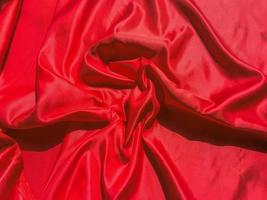 röd tyg textur för bakgrund med coy Plats. valentines dag eller jul dag tapet design foto