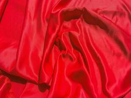 röd tyg textur för bakgrund med coy Plats. valentines dag eller jul dag tapet design foto
