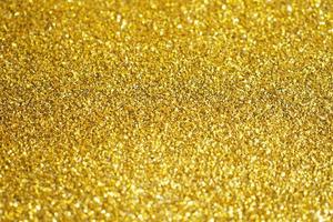 abstrakt guld glitter gnistra bakgrund foto