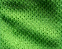 grön sporter Kläder tyg fotboll skjorta jersey textur stänga upp foto