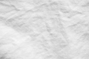 vit skrynkla bomull skjorta tyg trasa textur mönster bakgrund foto