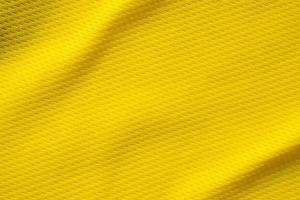 gul sporter Kläder tyg fotboll skjorta jersey textur stänga upp foto