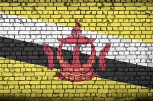 brunei darussalam flagga är målad till ett gammal tegel vägg foto