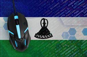 lesotho flagga och dator mus. digital hot, olaglig insatser på de internet foto