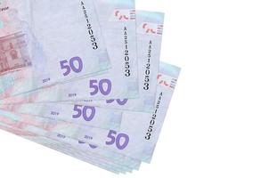 50 ukrainska hryvnias räkningar lögner i små knippa eller packa isolerat på vit. attrapp med kopia Plats. företag och valuta utbyta foto