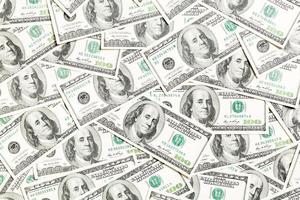 topp se av amerikan pengar bakgrund. lugg av dollar kontanter. papper sedlar begrepp foto