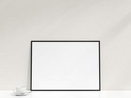interiör affisch attrapp med Foto ram lutande mot de vit vägg. minimalistisk Foto ram mockup. tömma ram står på vit tabell. 3d tolkning.