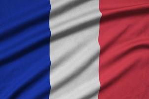 Frankrike flagga är avbildad på en sporter trasa tyg med många veck. sport team baner foto