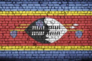 swaziland flagga är målad till ett gammal tegel vägg foto