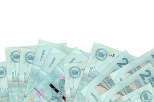 2 colombianska pesos räkningar lögner på botten sida av skärm isolerat på vit bakgrund med kopia Plats. bakgrund baner mall foto