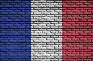 Frankrike flagga är målad till ett gammal tegel vägg foto