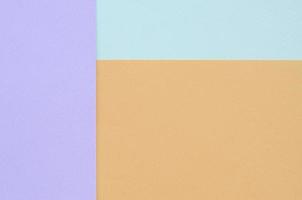 textur bakgrund av mode pastell färger. violett, orange, och blå geometrisk mönster papper. foto