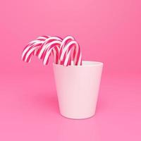 3d tolkning godis sockerrör på rosa bakgrund foto