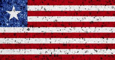 flagga av Liberia på en texturerad bakgrund. begrepp collage. foto