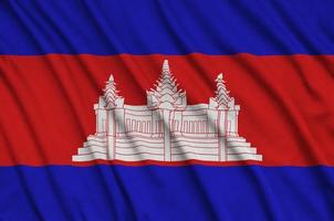 cambodia flagga är avbildad på en sporter trasa tyg med många veck. sport team baner foto