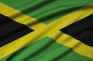 jamaica flagga är avbildad på en sporter trasa tyg med många veck. sport team baner foto