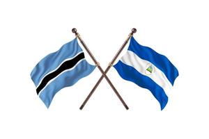botswana mot nicaragua två Land flaggor foto