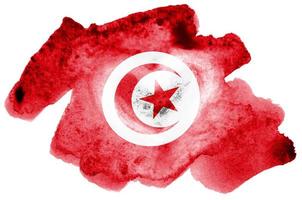 tunisien flagga är avbildad i flytande vattenfärg stil isolerat på vit bakgrund foto