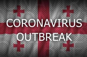 georgien flagga och coronavirus utbrott inskrift. covid-19 eller 2019-ncov virus foto