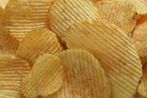 mat bakgrund med räfflad potatis pommes frites närbild foto