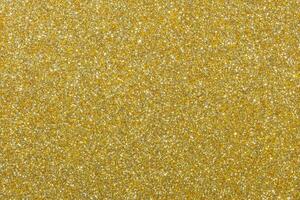 mörk guld glitter papper bakgrund foto