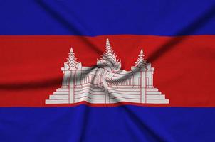 cambodia flagga är avbildad på en sporter trasa tyg med många veck. sport team baner foto