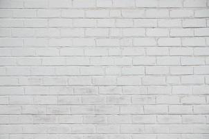 de textur av de tegel vägg, målad i vit foto