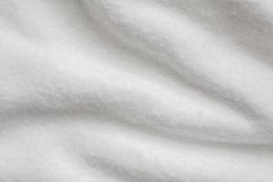vit fluffig päls tyg ull textur bakgrund foto