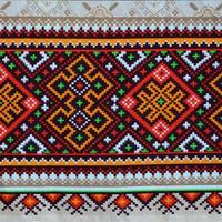 traditionell ukrainska folk konst stickat broderi mönster på textil- tyg foto