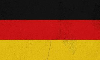 flagga av Tyskland på en texturerad bakgrund. begrepp collage. foto