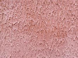 röd textur av dekorativ plåster bark skalbagge med taggar och en grov yta. de bakgrund foto