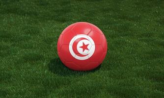 fotboll boll med tunisien flagga färger på en stadion på grön gräs bakgrund. 3d illustration. foto