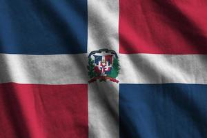 Dominikanska republik flagga med stor veck vinka stänga upp under de studio ljus inomhus. de officiell symboler och färger i baner foto