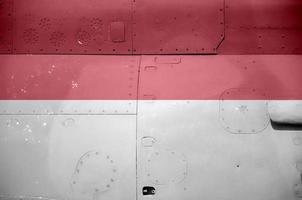 indonesien flagga avbildad på sida del av militär armerad helikopter närbild. armén krafter flygplan konceptuell bakgrund foto