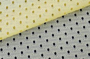 gul maska sport ha på sig tyg textil- bakgrund mönster foto