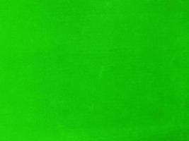 grön sammet tyg textur Begagnade som bakgrund. tömma grön tyg bakgrund av mjuk och slät textil- material. där är Plats för text. foto
