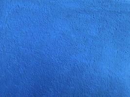 sömlös textur av blå cement vägg en grov yta, med Plats för text, för en bakgrund. foto