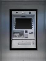 Bankomat maskin på ark metall vägg foto