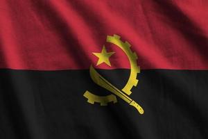 angola flagga med stor veck vinka stänga upp under de studio ljus inomhus. de officiell symboler och färger i baner foto