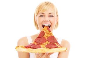 Lycklig kvinna med pizza foto