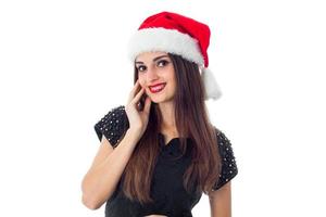 sötnos brunett flicka i santa hatt foto