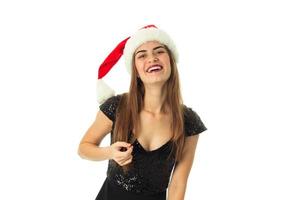 glad söt flicka i santa hatt foto