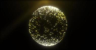 sfär cirkel boll tillverkad av små lysande flygande partiklar prickar korn av sand gul guld skinande ljus festlig. abstrakt bakgrund foto