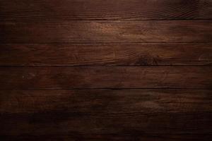 årgång brun trä bakgrund textur med knop och nagel hål. gammal målad trä vägg. brun abstrakt bakgrund. årgång trä- mörk horisontell brädor. foto