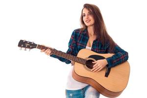 skönhet brunett kvinna med gitarr foto